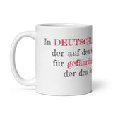 Kaffeebecher mit Spruch "In Deutschland gilt derjenige der auf den Schmutz aufmerksam macht als gefährlicher, als der derjenige der den Schmutz macht